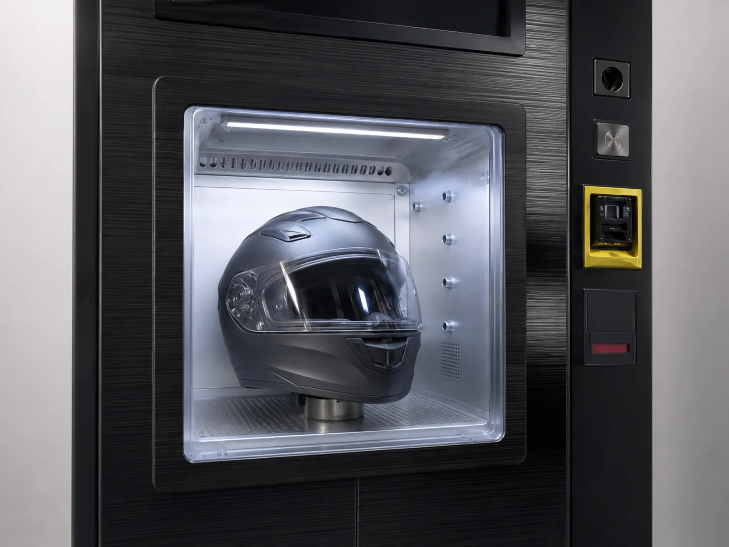 Helmet positioned inside the enclosed cleaning chamber